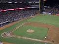 Batter gets ready for incoming pitch with runners taking lead