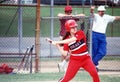 A batter in a high school softball game