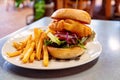 A Battered Fish Burger Served With Chips Royalty Free Stock Photo