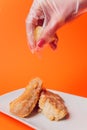 Battered fish fillet isolated over red background. Royalty Free Stock Photo