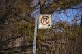 Battered No Parking sign