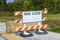 Battered Old Road Closed Sign