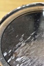 Battered transparent tenor drum head detail