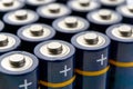 Blue alkaline AA batteries in rows Royalty Free Stock Photo