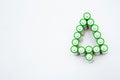 The batteries are in the shape of a Christmas tree on a white background. top view, flat lay, copy space, isolate Royalty Free Stock Photo