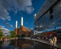Battersea, London, UK: Battersea Power Station with pond and people