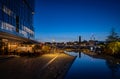 Battersea, London, UK: Ponds in a park and restaurant near Battersea Power Station at night Royalty Free Stock Photo