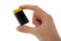 Battery - 9v (PP3) in fingers Royalty Free Stock Photo