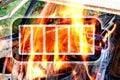 Battery fire, illustration of Li-Ion battery in front of burnt car Royalty Free Stock Photo
