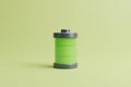 Battery with green level indicator on light green background Royalty Free Stock Photo