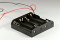 Battery holder AA. Holder for four batteries. Royalty Free Stock Photo
