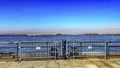 Battery Park Slip 6 pier walk, which is next to Castle Clinton in New York City, from this side of the Big Apple. Royalty Free Stock Photo