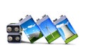 Battery with solar panels, wind turbines and nuclear power plant isolated on white background. Royalty Free Stock Photo