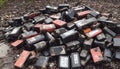 Battery waste danger: pile of old, used EV car batteries hazardous waste Royalty Free Stock Photo