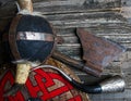 Ax horned helmet signal horn and shield covered with viking runes on rough wooden table top view