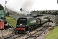 Battle of Britain Class Steam Loco No 34070 `Manston` departs Swanage Station on the Swanage Railway - Corfe Castle, Dorset, UK Royalty Free Stock Photo