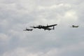 Battle of Britain Flight featuring a Lancaster WW2 bomber and a Hurricane and Spitfire. Royalty Free Stock Photo