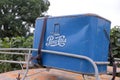 Vintage blue Pepsi-Cola metal cooler latched onto a roof rack of a red rusty Royalty Free Stock Photo