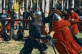 Battle of knights in the arena. Swords, shields, helmets and armor. Royalty Free Stock Photo