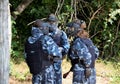 Battle at paintball. A small group of young players, fully equipped