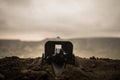 Battle scene. Silhouette of old field gun standing at field ready to fire. With colorful dark foggy background. Selective focus Royalty Free Stock Photo