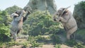 Battle of two large African elephants in the green jungle on a sunny day. A look at the African jungle. 3D Rendering.