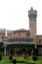 A battlement tower of bangalore palace view with beautiful garden. Royalty Free Stock Photo
