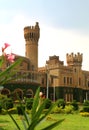 A battlement tower of bangalore palace view with beautiful garden. Royalty Free Stock Photo