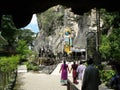 People entering a Batu Caves temple. Malaysia Royalty Free Stock Photo