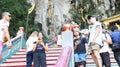 Batu Caves, Kuala Lumpur, Malaysia May, 28 2017 - Tourists interacting with monkeys Royalty Free Stock Photo