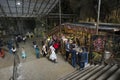 Tourists seen exploring and praying in the Hindu Temple, Batu Caves, Malaysia. Royalty Free Stock Photo