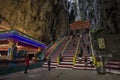 Tourists seen exploring and praying in the Hindu Temple, Batu Caves, Malaysia. Royalty Free Stock Photo