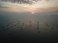 Aerial view fish farm in magnificent sunset hour.