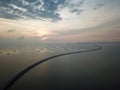 Sultan Abdul Halim Muadzam Shah Bridge across sea in sunset.