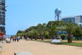 Embankment of Batumi with alley of palm trees, bicycle path and modern architecture