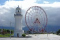 BATUMI, ADJARA, GEORGIA -SEPTEMBER 9, 2017: Seafront Promenade on Black Sea coast with ferris wheel and lighthouse view in Batumi
