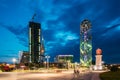 Batumi, Adjara, Georgia. Under Construction Skyscraper, Illuminated Alphabet Tower And Lighthouse At Promenade Near