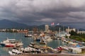 BATUMI, GEORGIA, AJARIA - September 06, 2022: Top view of Batumi seaport, cargo ships in the port, mountains and sea