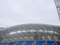 Arch of the stadium. Engineering design. Part of the roof of the stadium. Rain canopy in a modern stadium