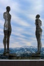 Batumi, Georgia, Famous Statue of Love called Ali and Nino on snowy mountain peaks background