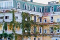 General architecture - facade of traditional residential building, covered with ivy and grape varnish. Royalty Free Stock Photo