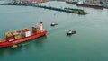 Batumi, Georgia - 26 January 2024: Aerial view of cargo ship carrying containers for import and export, business