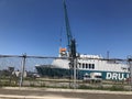 Batumi, GEORGIA -  - July 29, 2019: Cranes near the ship in port. Big gate near the port of seaside. Sunny day in the city Royalty Free Stock Photo