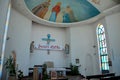 Pews pulpit statues and Jesus ceiling art Catholic Church of Holy Spirit Batumi Georgia