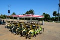 Yellow and green tandem cycles for rent at Black sea front by tourists Batumi Georgia