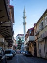 minaret of the mosque rises above the buildings in the old city. Turkish quarter. Georgian architecture Royalty Free Stock Photo