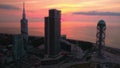 Batumi, Georgia - 2018: modern buildings on a pink sky background, shot from a drone