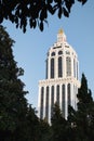 BATUMI, GEORGIA - November 19 2019 : Sheraton Casino and Hotel Building. Bottom view Clock tower. 5 stars. Blue sky on