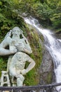 Batumi, Georgia Ã¢â¬â September, 2021: Andrew the First-Called waterfall and statue, near the village of Sarpi in the Ajara, Georgia