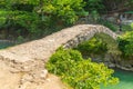 BATUMI, GEORGIA: Stone arch bridge of Queen Tamara near the Adjaristskali River on a sunny summer day. Royalty Free Stock Photo